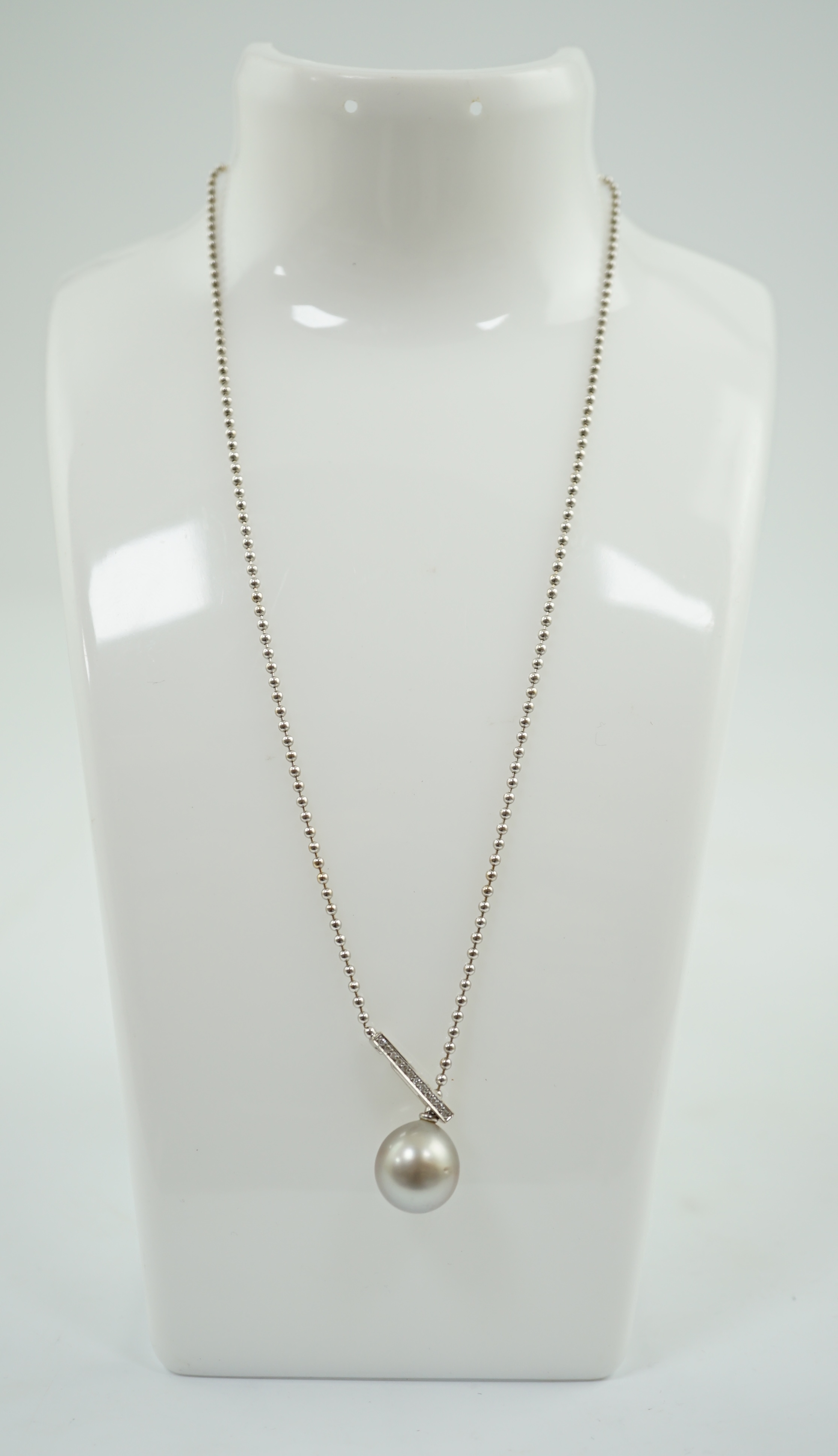 A modern Boodles & Dunthorne 18ct white gold, single stone Tahitian cultured pearl and diamond chip set pendant necklace